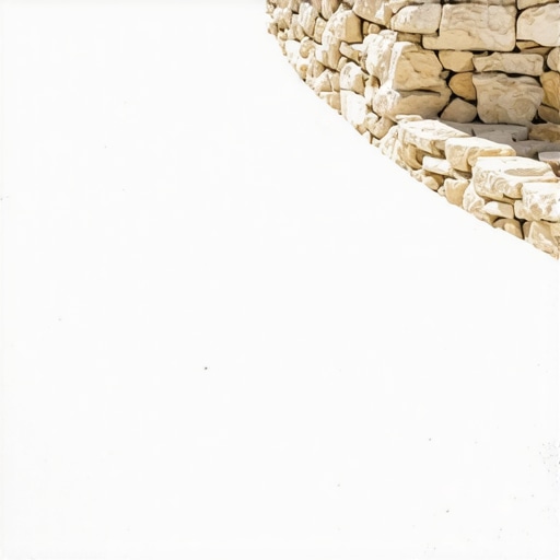 A high-end white composite deck merging with a natural stone wall for a Mediterranean aesthetic.